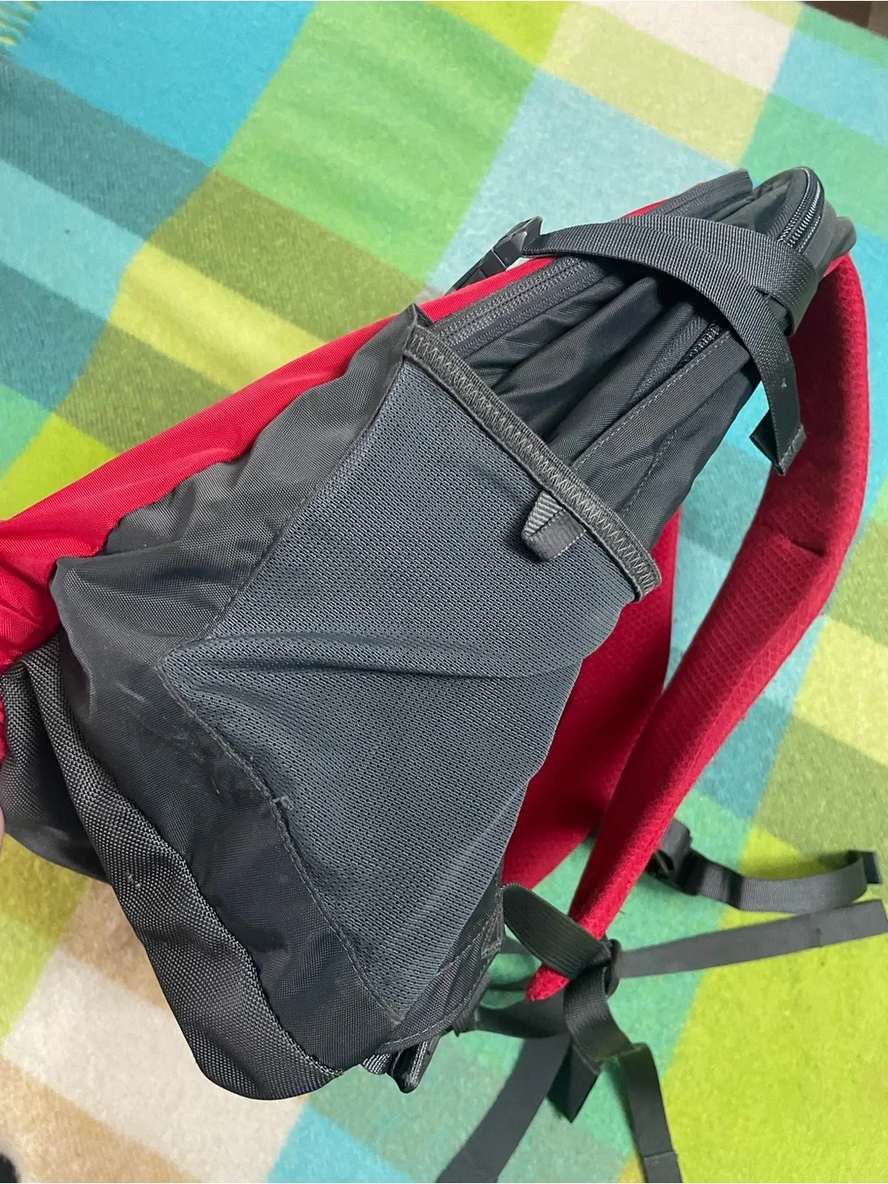 The North Face Recon backpack in charcoal gray and bright red